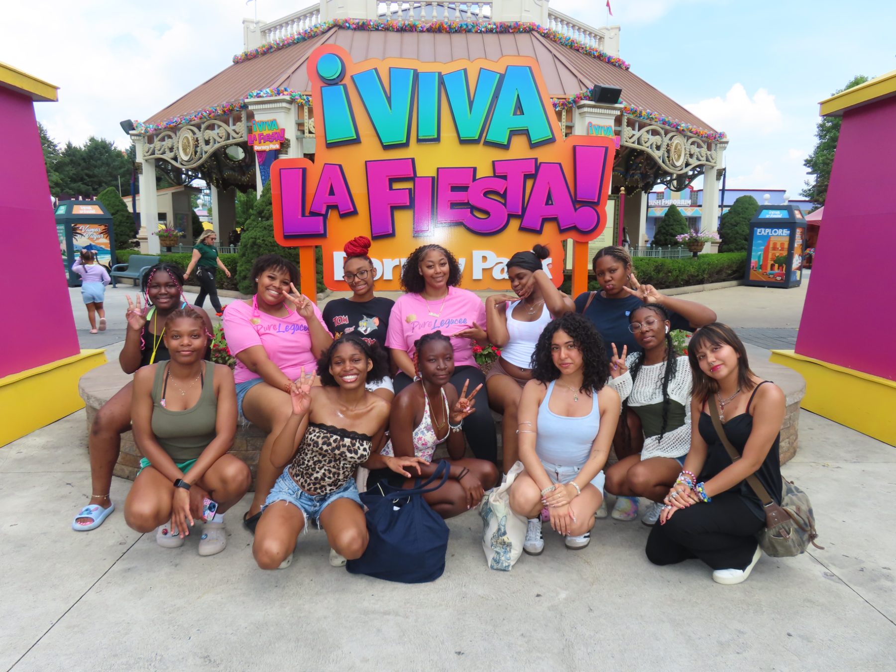 PureLegacee participants smiling together on a trip to an amusement park